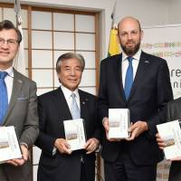Gediminas Varvuolis, ambassador of Lithuania (far left), poses with (from second left) Hirofumi Nakasone, president of the Japan-Lithuania Parliamentary Friendship League; Darius Skusevicius, vice minister of foreign affairs of Lithuania; and Michimasa Oe, president of Akashi Shoten Co., Ltd. during a reception to celebrate the release of a book titled \"The History of Lithuania\" in Japanese at the Lithuanian Embassy on May 15. | YOSHIAKI MIURA