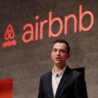 Nathan Blecharczyk, co-founder and chief strategy officer for Airbnb, speaks at an Airbnb event in Tokyo on Thursday. | REUTERS