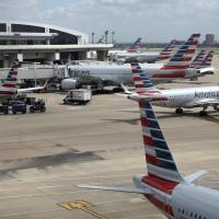 American Airlines aircrafts are seen at Dallas-Fort Worth International Airport in Grapevine, Texas, June 16. American Airlines says it asked the Trump administration not to put migrant children who have been separated from their parents on its flights. In a statement Wednesday, American said it doesn\'t know whether any migrant children have been on its flights and doesn\'t want to profit from the current immigration policy of separating families. | AP