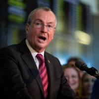 New Jersey Gov. Phil Murphy speaks on Thursday before placing a bet at the Monmouth Park Sports Book on the first day of legal sports betting in the state, in Monmouth, New Jersey. | AFP-JIJI