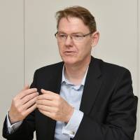 Holger Gerkens, who heads Japan Display Inc.\'s automotive display business, speaks during an interview in Minato Ward, Tokyo, on June 11. | YOSHIAKI MIURA