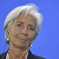Managing Director of the International Monetary Fund (IMF) Christine Lagarde looks on during a press conference at the Chancellery in Berlin on Monday. | AFP-JIJI
