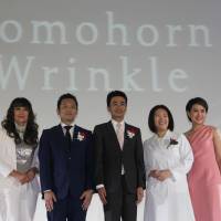 Masaaki Nishikawa (center), president of Japan\'s Saishunkan Pharmaceutical Co., and other company officials join an event to launch its anti-aging skin care product Domohorn Wrinkle in Bangkok on June 4. | NNA / VIA KYODO
