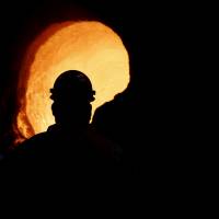 Senior melt operator Randy Feltmeyer examines a giant ladle after dumping its contents of red-hot iron used in the production of steel at the U.S. Steel Granite City Works facility Thursday in Granite City, Illinois. | AP