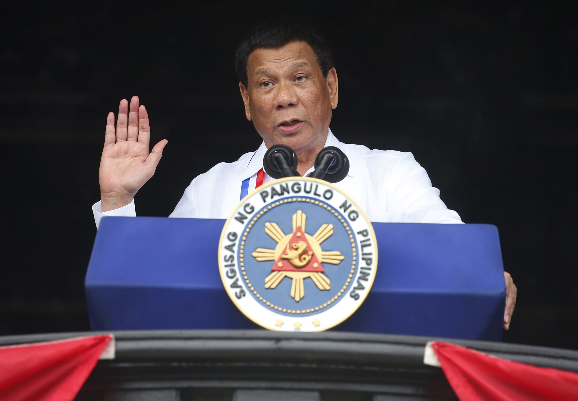 Philippine President Rodrigo Duterte gestures while addressing the crowd at the 120th Philippine Independence Day celebrations south of Manila on June 11. | AP