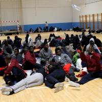 Migrants intercepted off the coast of Spain are being kept temporarily in a sports center in the southern port of Barbate. | REUTERS