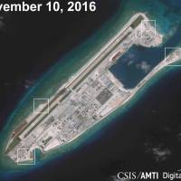 A satellite image shows what appears to be anti-aircraft guns and what are likely to be close-in weapons systems on the artificial island Fiery Cross Reef in the South China Sea in this image released in December 2016. | CSIS ASIA MARITIME TRANSPARENCY INITIATIVE / DIGITALGLOBE / VIA REUTERS