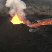 This photo provided by the U.S. Geological Survey shows fountaining from what is known as fissure 8 in Kilauea Volcano\'s lower East Rift Zone on the island of Hawaii at around 6:30 a.m. Saturday. Overnight, fountain heights were generally 130-160-feett high, with occasional bursts up to just under 200 feet high. | U.S. GEOLOGICAL SURVEY / VIA AP