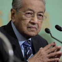 Mahathir Mohamad, Malaysia\'s prime minister, pauses during a news conference at the Japan National Press Club in Tokyo on Monday. | BLOOMBERG