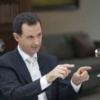 Syrian President Bashar Assad speaks during an interview with Greece\'s Kathimerini newspaper in Damascus on May 10. | AP