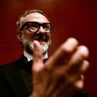 Massimo Bottura, the chef patron of the Osteria Francescana restaurant in Italy, gestures after receiving the award for Best Restaurant during the World\'s 50 Best Restaurants Awards at the Palacio Euskalduna in Bilbao, Spain, Tuesday. | REUTERS