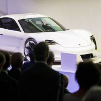 A Porsche AG Taycan electric automobile sits on display as the luxury automaker celebrates its 70th anniversary in Stuttgart, Germany, on Friday. Porsche AG named its first car to directly compete with electric leader Tesla Inc. the Taycan, as the German manufacturer gears up for what will arguably be its most ambitious and potentially risky vehicle project ever. | BLOOMBERG