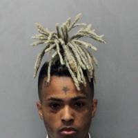 This 2017 arrest photo made available by the Miami Dade Dept. of Corrections shows Jahseh Onfroy, also known as the rapper XXXTentacion, under arrest. Onfroy was shot and killed Monday in Deerfield Beach, Florida. | MIAMI DADE DEPT. OF CORRECTIONS / VIA AP