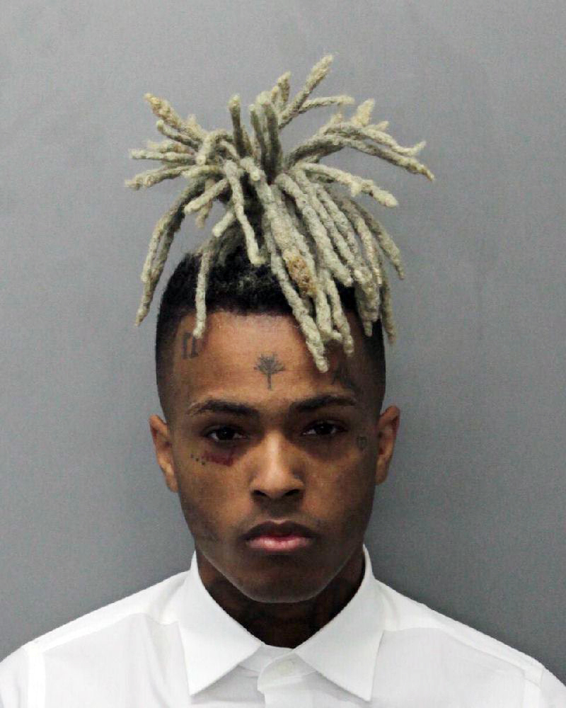 This 2017 arrest photo made available by the Miami Dade Dept. of Corrections shows Jahseh Onfroy, also known as the rapper XXXTentacion, under arrest. Onfroy was shot and killed Monday in Deerfield Beach, Florida. | MIAMI DADE DEPT. OF CORRECTIONS / VIA AP