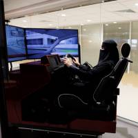 Amira Abdulgader practices driving on a simulator at Saudi Aramco Driving Center in Dhahran, Saudi Arabia, on June 6. | REUTERS