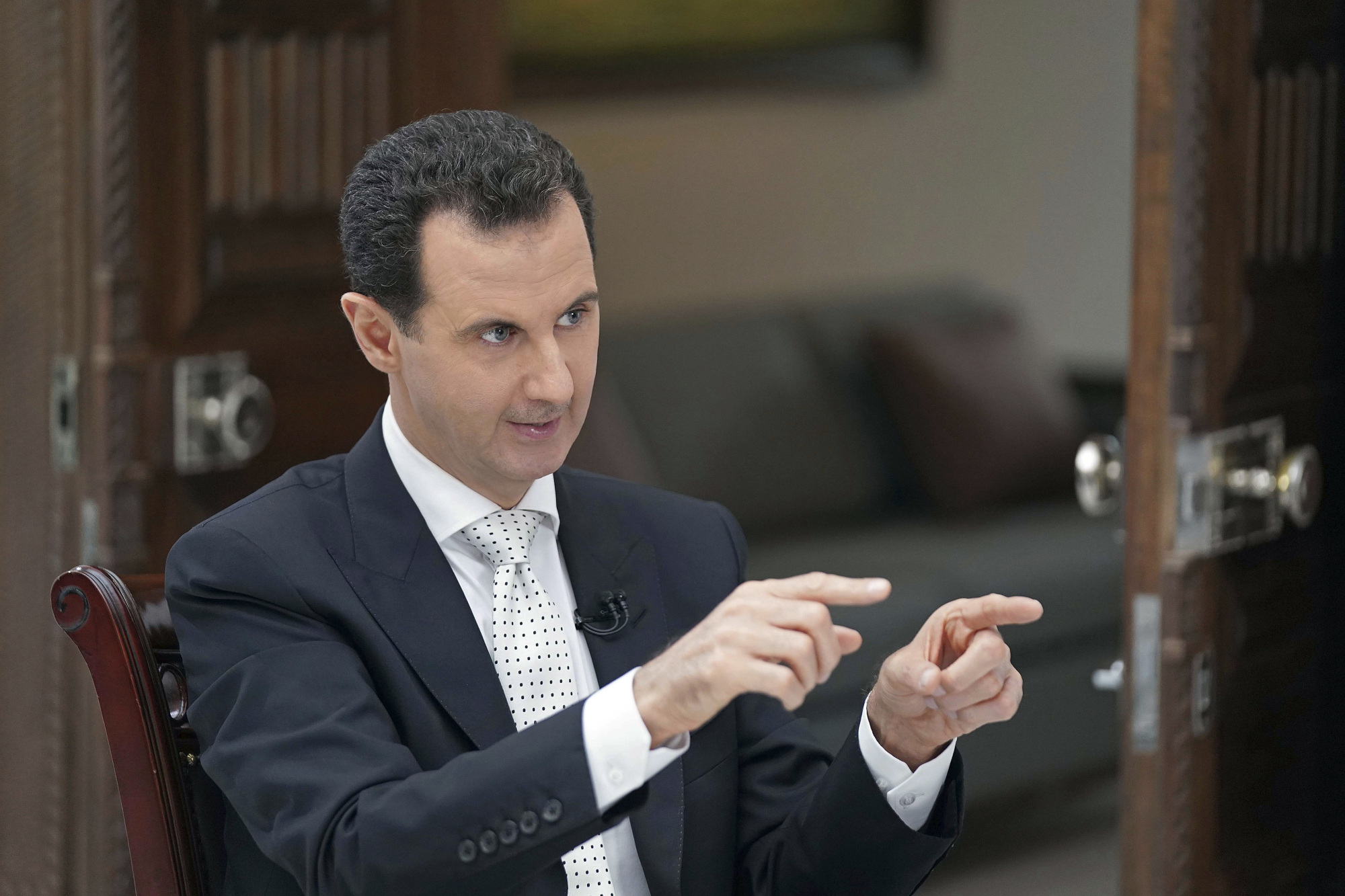 Syrian President Bashar Assad speaks during an interview in Damascus on May 10. | SANA / VIA AP