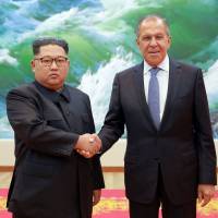 This Thursday picture released from North Korea\'s official Korean Central News Agency (KCNA) onFriday shows North Korean leader Kim Jong-Un (left) greeting Russian Foreign Minister Sergey Lavrov in Pyongyang. | KCNA VIA KNS / VIA AFP-JIJI