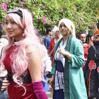 Fans of cosplay gather for an event in Bengaluru, India, in March. | KYODO