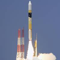 An H-IIA rocket carrying a satellite for information gathering is launched from the Tanegashima Space Center in Kagoshima Prefecture on Tuesday. | KYODO