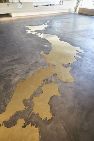 A brass map of Japan sits on the floor of Nousaku in Takaoka, Toyama Prefecture.