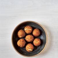 A celebration of sesame: Okinawan-style sesame donuts. | JAPAN THE COOKBOOK / PHAIDON
