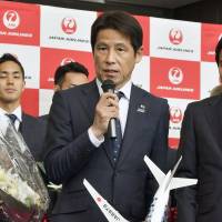 Japan men\'s national team soccer manager Akira Nishino speaks at a departure ceremony at Narita airport on Saturday. The team is traveling to Austria for training before the upcoming World Cup. | KYODO