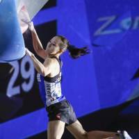 Akiyo Noguchi competes in a bouldering World Cup event in Tokyo on Sunday. | KYODO