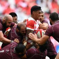 Georgia players surround Japan\'s Timothy Lafaele during their test match on Saturday in Toyota, Aichi Prefecture. | AFP-JIJI