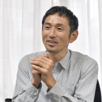 Former Olympic hurdler Dai Tamesue speaks during a May 31 interview with The Japan Times in Tokyo. | YOSHIAKI MIURA