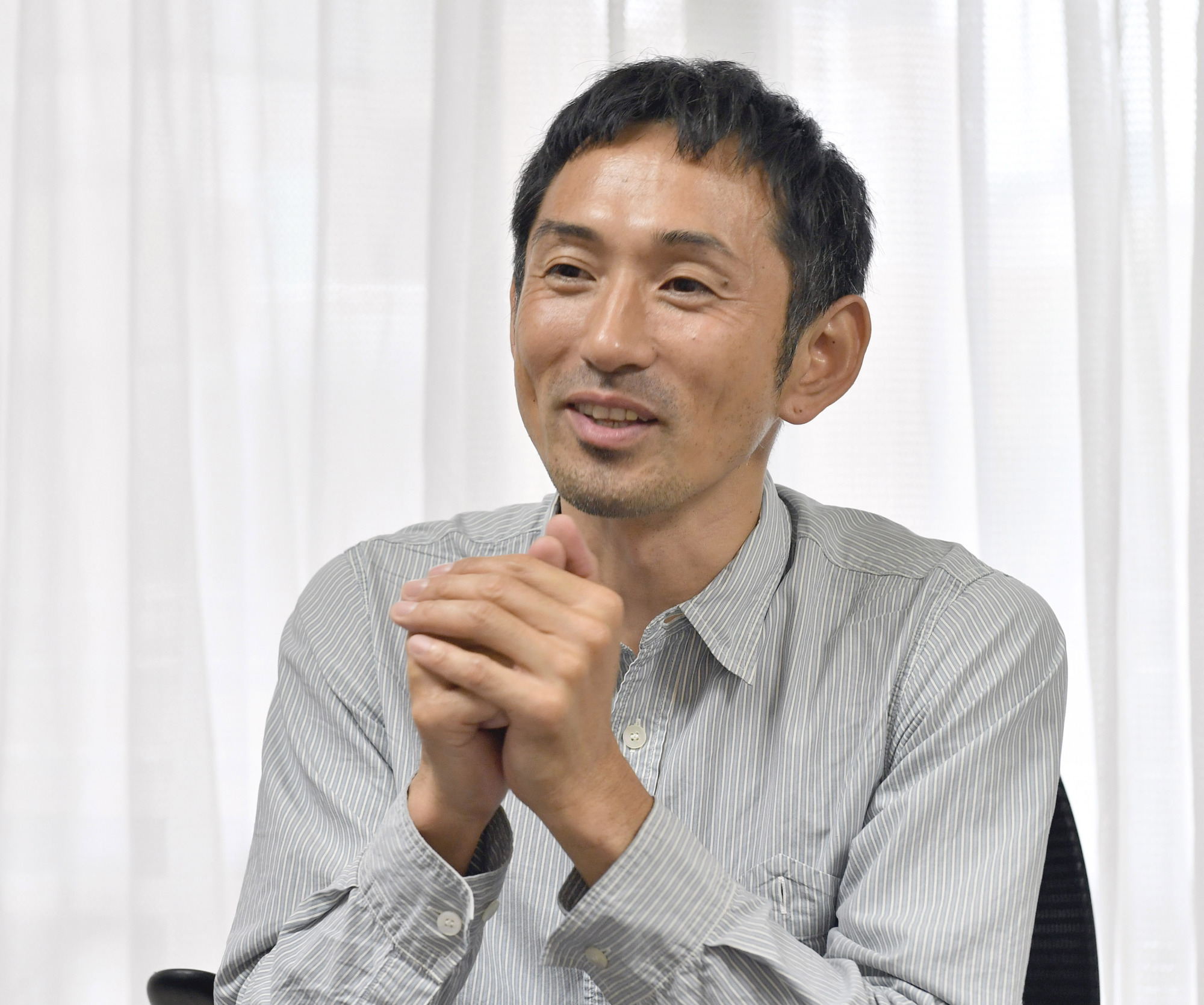 Former Olympic hurdler Dai Tamesue speaks during a May 31 interview with The Japan Times in Tokyo. | YOSHIAKI MIURA