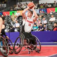 Canada\'s Pat Anderson attempts a shot against Japan during their World Challenge Cup game on Saturday at Musashino Forest Sport Plaza. | KAZ NAGATSUKA