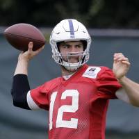 Indianapolis Colts QB Andrew Luck throws a pass at practice on Wednesday. Luck is still recovering from surgery in January 2017 on his right shoulder. | AP