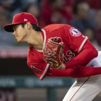 Angels pitcher Shohei Ohtani is sidelined with a sprained ligament in his right elbow. | AP