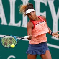 Naomi Osaka hits a return to Slovenia\'s Dalila Jakupovic  in the second round at the Nature Valley Classic on Wednesday in Birmingham, England. | ACTION IMAGES VIA REUTERS