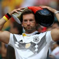 A Germany fan looks dejected after the Sunday match as his team was defeated by Mexico 1-0. | REUTERS
