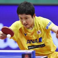 Tomokazu Harimoto competes against two-time Olympic champion Ma Long of China on Saturday in the Japan Open quarterfinals in Kitakyushu. Harimoto won 11-8, 11-9, 11-7, 3-11, 2-11, 11-6. | KYODO