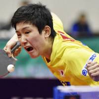 Tomokazu Harimoto competes during the final day of the Japan Open on Sunday. Harimoto won the men\'s singles title. | KYODO