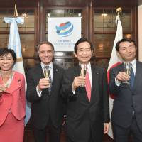 Argentinian Ambassador Alan Beraud (second from left) raises a toast with (from left) Secretary-General of the Japan-Argentina Parliamentary Friendship League Yukari Sato, Chairman Kozo Yamamoto and Teiji Hayashi of the Foreign Ministry during a reception to celebrate the 120th anniversary of diplomatic relations between Argentina and Japan at the ambassador\'s residence on May 25. | YOSHIAKI MIURA