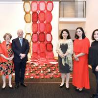 Portuguese Ambassador Francisco Xavier Esteves  (third from left) and his wife, Ilda (second from left), pose for a photo with (from left) gallery owner Mika Asakura, Vila do Conde Mayor Maria Elisa Ferraz, artist Cristina Rodrigues and Helena Costa, head designer of Alma de Luce, during a reception to celebrate Portugal\'s national day and the opening of an exhibition titled \"Echoes of the Sea\'\' at Hillside Forum in Tokyo on June 12. | YOSHIAKI MIURA