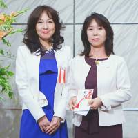 Yuko Hayashi (left), chairperson of Tokyo Women\'s Club, poses for a photo with Sayuri Daimon, managing editor of The Japan Times, after donating &#165;200,000 to The Japan Times Readers\' Fund during an event to celebrate the club\'s 110th anniversary in Tokyo on June 1. | MISA NOMOTO