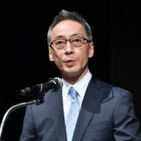 Marui Group Co. President Hiroshi Aoi delivers his keynote speech at a symposium in Tokyo on May 22. | YOSHIAKI MIURA