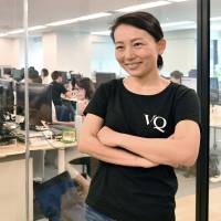 Eiko Hashiba, co-founder and CEO of VisasQ Inc., stands in her office at Aobadai in Tokyo\'s Meguro Ward, on June 13. | YOSHIAKI MIURA