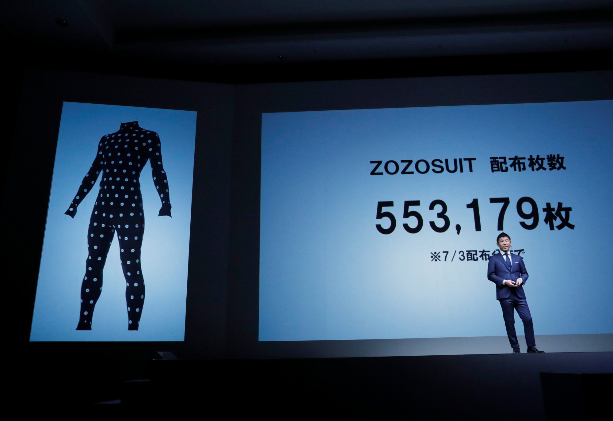 Zozo Chief Executive Officer Yusaku Maezawa gives a presentation about the company's measurement-taking Zozosuit at an event in Tokyo on Tuesday launching the debut of its formal apparel items. | REUTERS