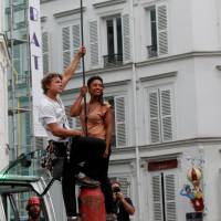 Tatian-Mosio Bongonga prepares to walk a tightrope in Paris on Saturday. | REUTERS