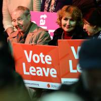 Brexit supporters wait for the start of a Vote Leave rally in April 2016 in Manchester, England. | AFP-JIJI