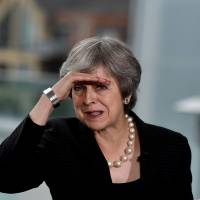 British Prime Minister Theresa May delivers a speech at the Waterfront Hall in Belfast, Northern Ireland, on Friday. | REUTERS