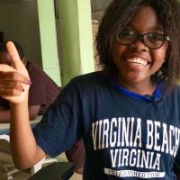 Xaviera Nguefo, 15, explains why she likes robotics at the NextGen Technology Center on July 11. | THOMSON REUTERS FOUNDATION / INNA LAZAREVA