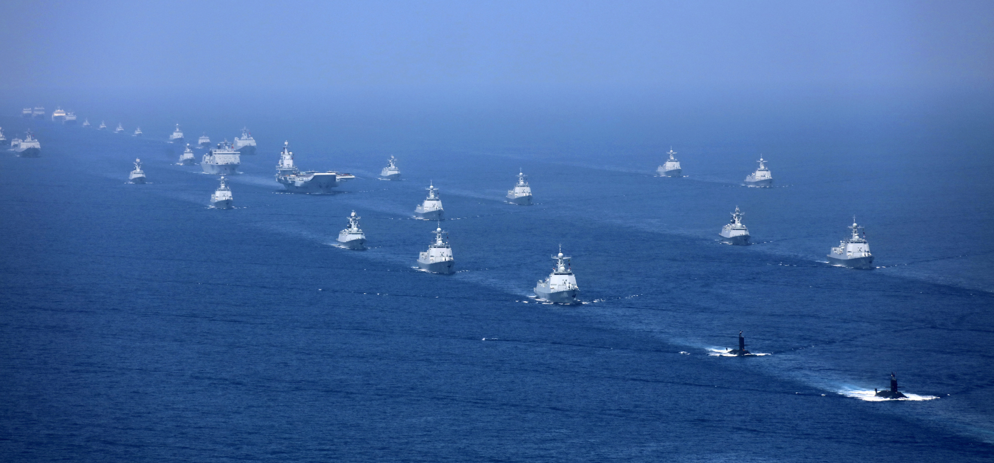 China's Liaoning aircraft carrier is accompanied by navy frigates and submarines conducting an exercises in the South China Sea in April. | AP