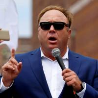 Alex Jones, of Infowars.com, speaks during a rally in support of then-presidential candidate Donald Trump near the Republican National Convention in Cleveland in July 2016. | REUTERS