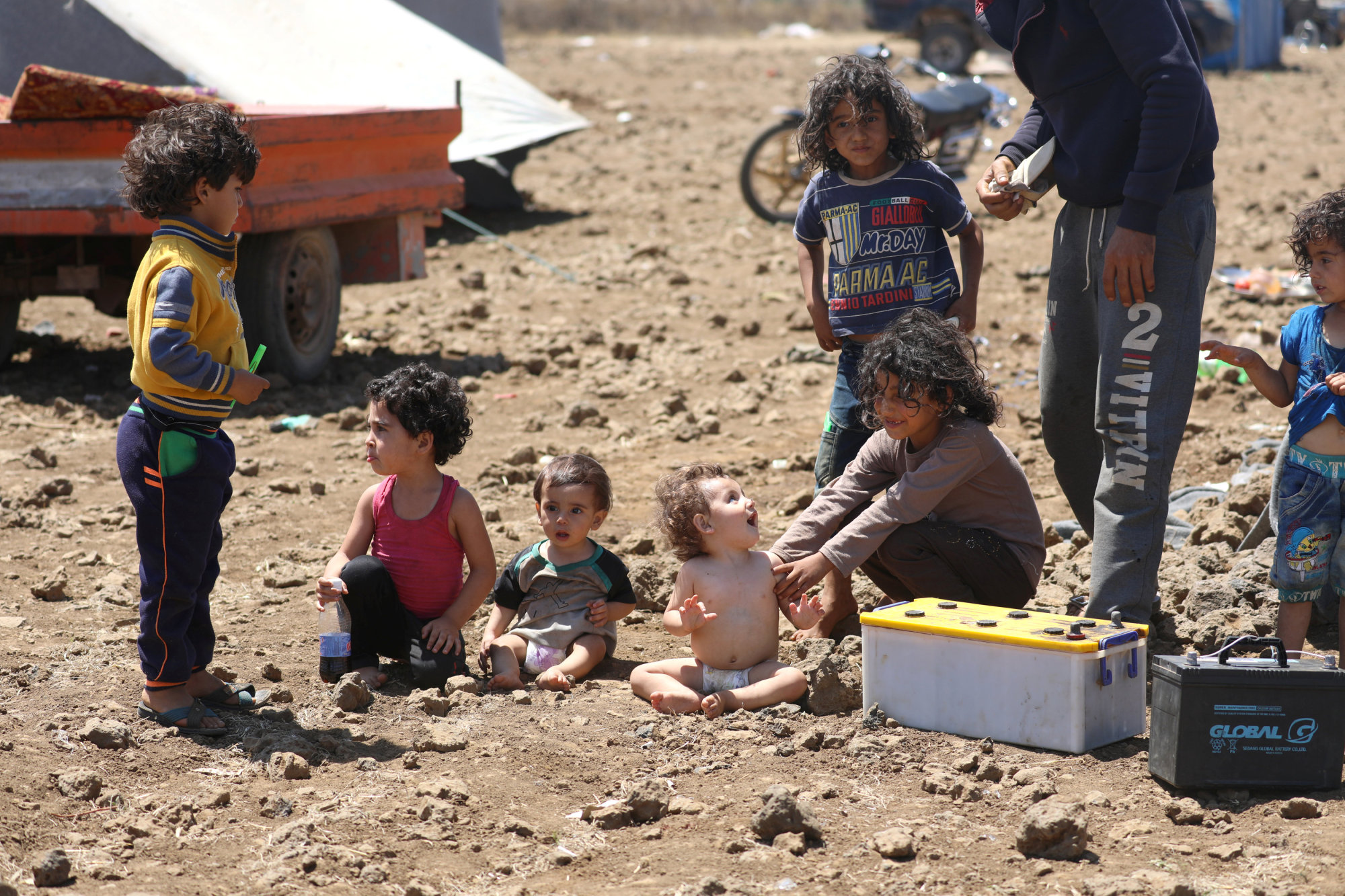 Internally displaced children from Deraa sit together near the Israeli-occupied Golan Heights in Quneitra, Syria, Wednesday. | REUTERS